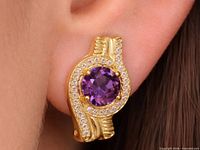 Earring worn on ear showing size and design