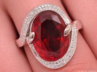 Top view of ring on finger showing created ruby and CZ halo