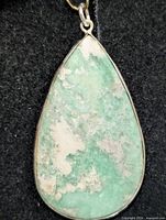 Front view of teardrop variscite pendant in silver bezel