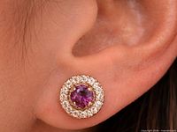 earring worn in ear showing scale and halo design