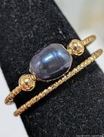 Front view of ring showing dyed pearl and double bands