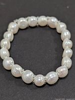 Full view of freshwater pearl stretch bracelet showing all pearls and bead spacers