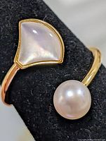 Ring front view showing pearl and mother-of-pearl elements