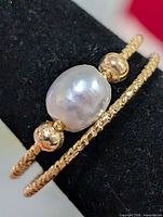 Front view showing pearl and bead detail on ring