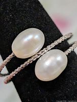 Front view of ring showing two freshwater pearls on double band