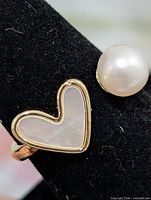 Front view of ring showing pearl and heart inlay