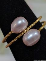 Front view showing two pearls on double rope band