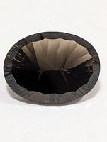 Top view of faceted oval smokey quartz