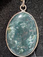 front view showing overall pendant design and stone pattern