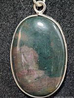 front view oval green fluorite pendant in silver bezel