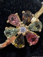 Top view showing multicolour tourmaline petals and central clear stone