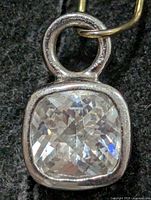 Front view showing cushion-cut CZ in silver bezel with bail