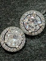 front view of both earrings showing centre and halo stones