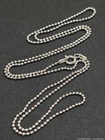Full view of silver bead chain laid out