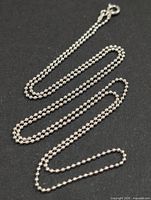 Full view of silver bead chain laid out