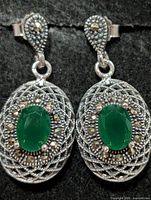 Front view of both earrings showing green onyx centers and marcasite detailing