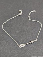 Full view of silver arrow bracelet with extender chain