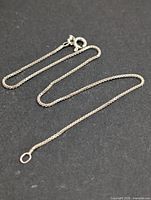 Full view of silver chain bracelet laid flat