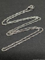 Full view of silver rope chain laid out