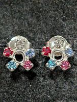 Front view of both stud earrings showing stone colours and arrangement