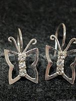 front view showing butterfly shape and stones