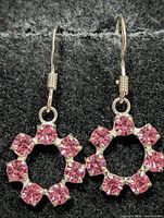 Front view of both earrings showing overall design and stones