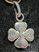 Front view of silver four-leaf clover pendant with bail