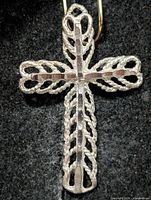 Front of silver filigree cross pendant