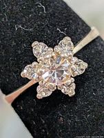 Front view of ring showing floral cluster setting