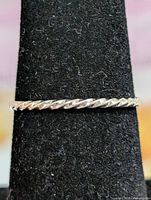 Ring on mandrel display showing twisted rope design