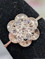 front view of floral cluster ring showing stone arrangement