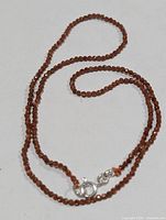 Full view of necklace showing bead strand and clasp