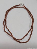 Full view of the faceted sandstone bead necklace