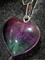 front view of heart pendant showing purple to green gradient and bail
