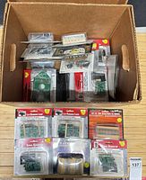 Box overview showing multiple sealed Velleman kits and resistor sets