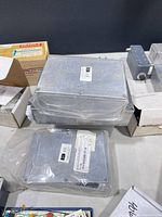 stacked sealed aluminium modules with labels and additional small RF box