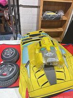 Full view of costume with jumpsuit, armor, wheels