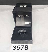 Ring in open King Will box showing presentation and item number