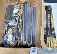 Overview of box with many IC tubes and misc parts