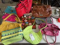 Group shot of all nine handbags on table