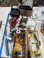 Overview of all meters, soldering pump, solder spool, leads and components