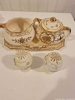Full set with tray, cream pitcher, sugar bowl, salt and pepper shakers
