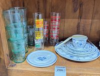 Overall shot showing stoneware stack, separate plate and grouped glassware