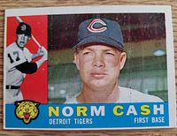 Front of 1960 Topps Norm Cash #488 card showing player images and text