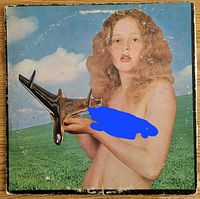 Front album cover with girl and aircraft showing wear
