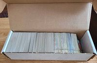 Open card box showing large stack of cards