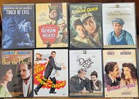 Front covers of eight classic movie DVDs