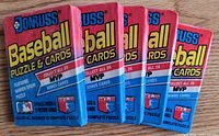 Front view of five sealed 1989 Donruss Baseball Puzzle & Cards wax packs fanned out