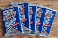 Front view of five sealed Upper Deck 1991 baseball card packs
