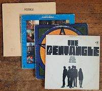 All four Pentangle album covers fanned out on wood floor